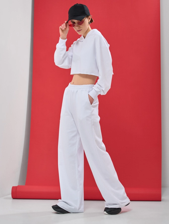 Брюки-клеш из футера с необработанным краем