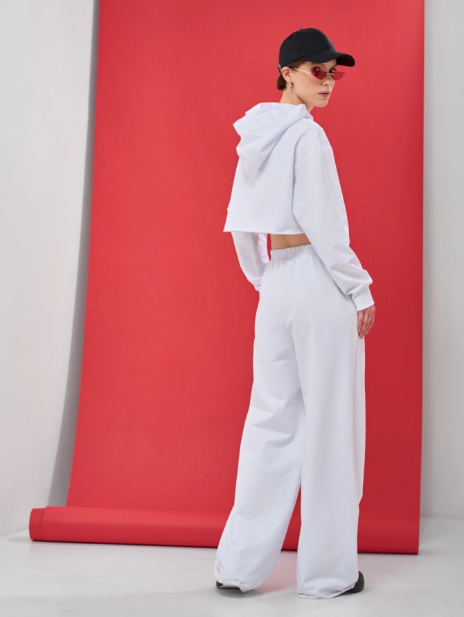 Брюки-клеш из футера с необработанным краем