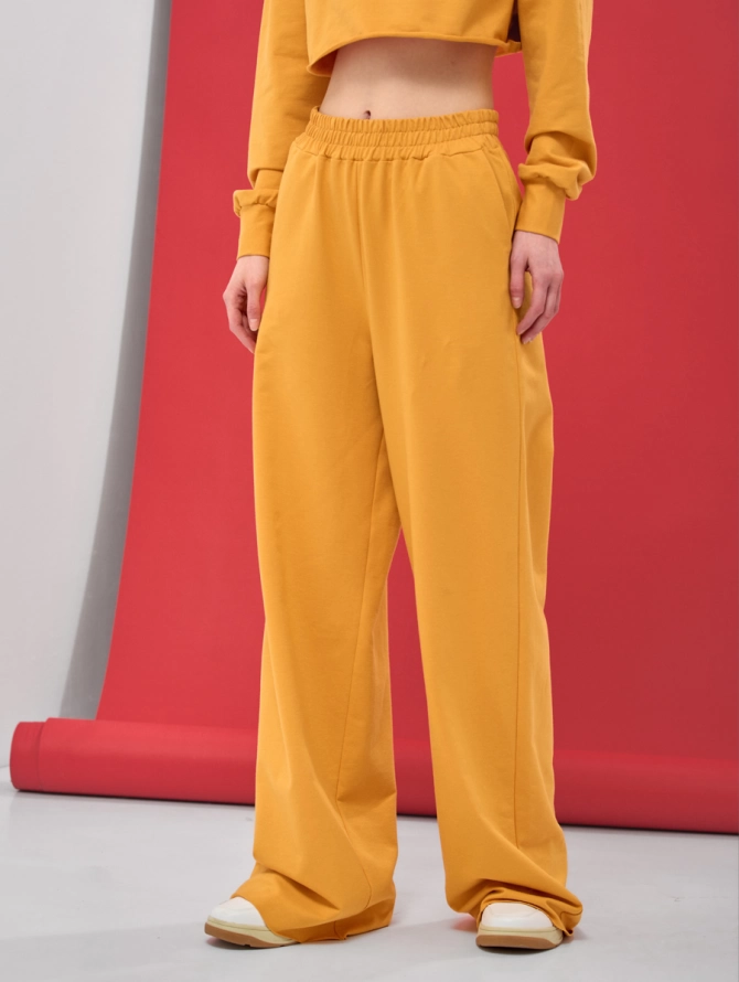 Брюки спортивные клеш из футера горчичные